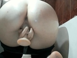 Russian teen masturbates with sex toy to orgasm in bathroom.